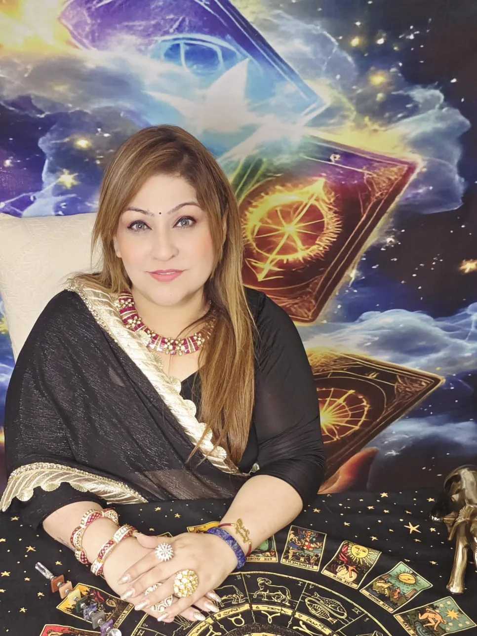 Dr. Isha Kaurr seated at a tarot reading table