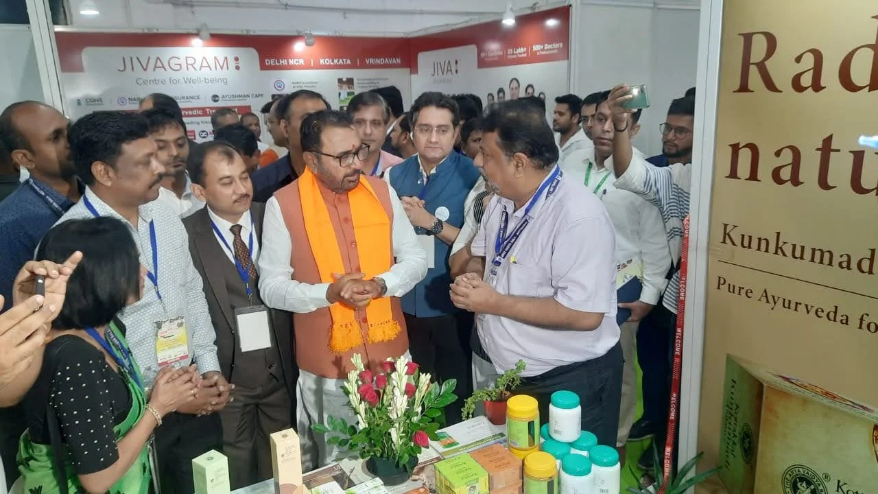 Dr. Partha Narayan Joardar engaging with visitors at an Ayurveda industry exhibition stall